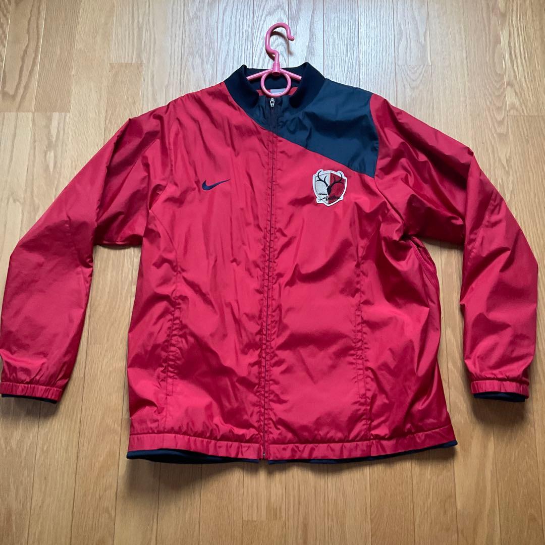 鹿島アントラーズNike ピステ・ウィンドブレーカー レッド/ネイビー