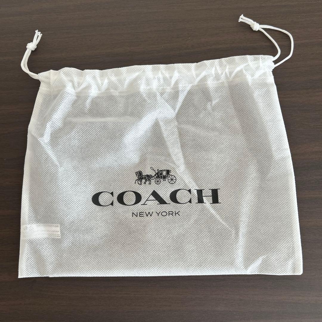 ①【新品】COACH レザー iPhone 15 ケース　手帳型スマホケース