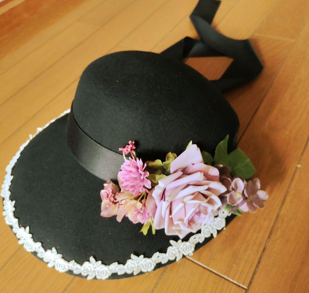 イノセントワールド　黒い花飾り付き広つばハット