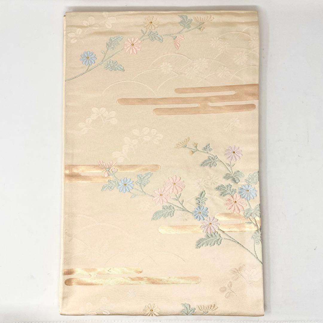 未使用［ 名古屋帯/ポリエステル ］東レシルック　生成り　菊　霞　芝草　洗える