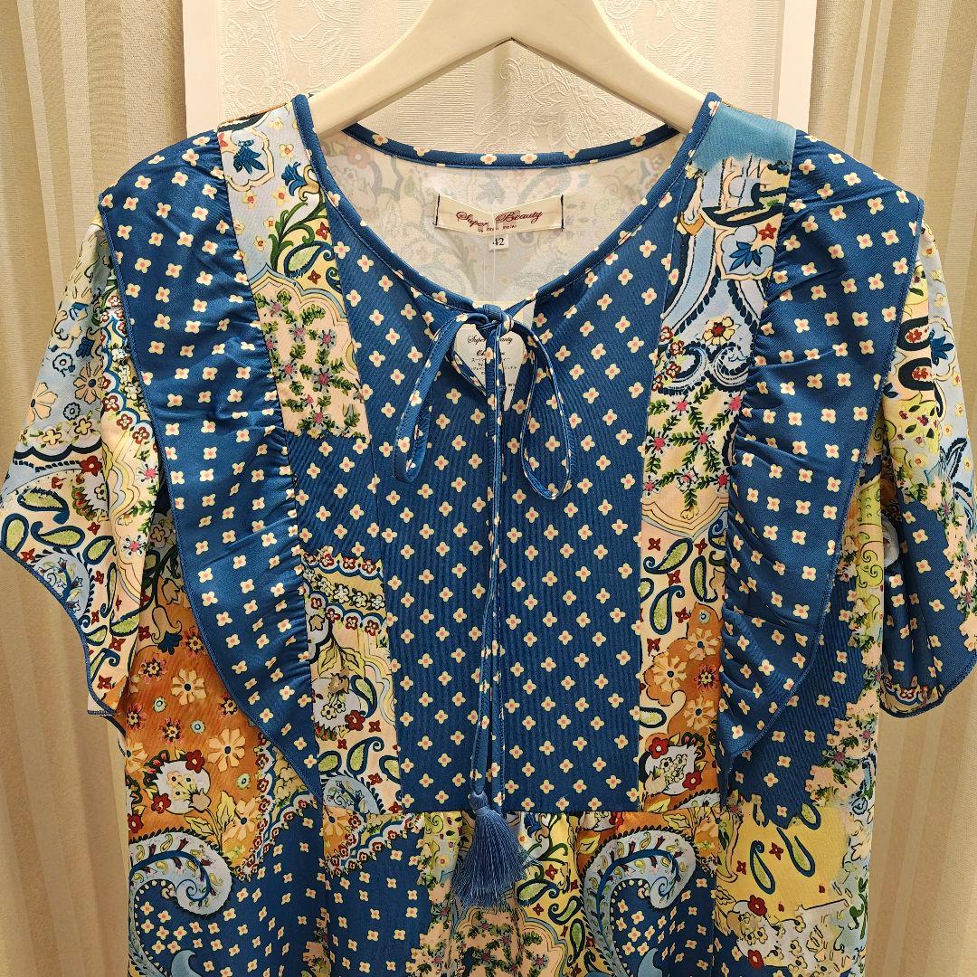 S121:新品 チュニックプリント タッセルリボン ブルー系 サイズ42