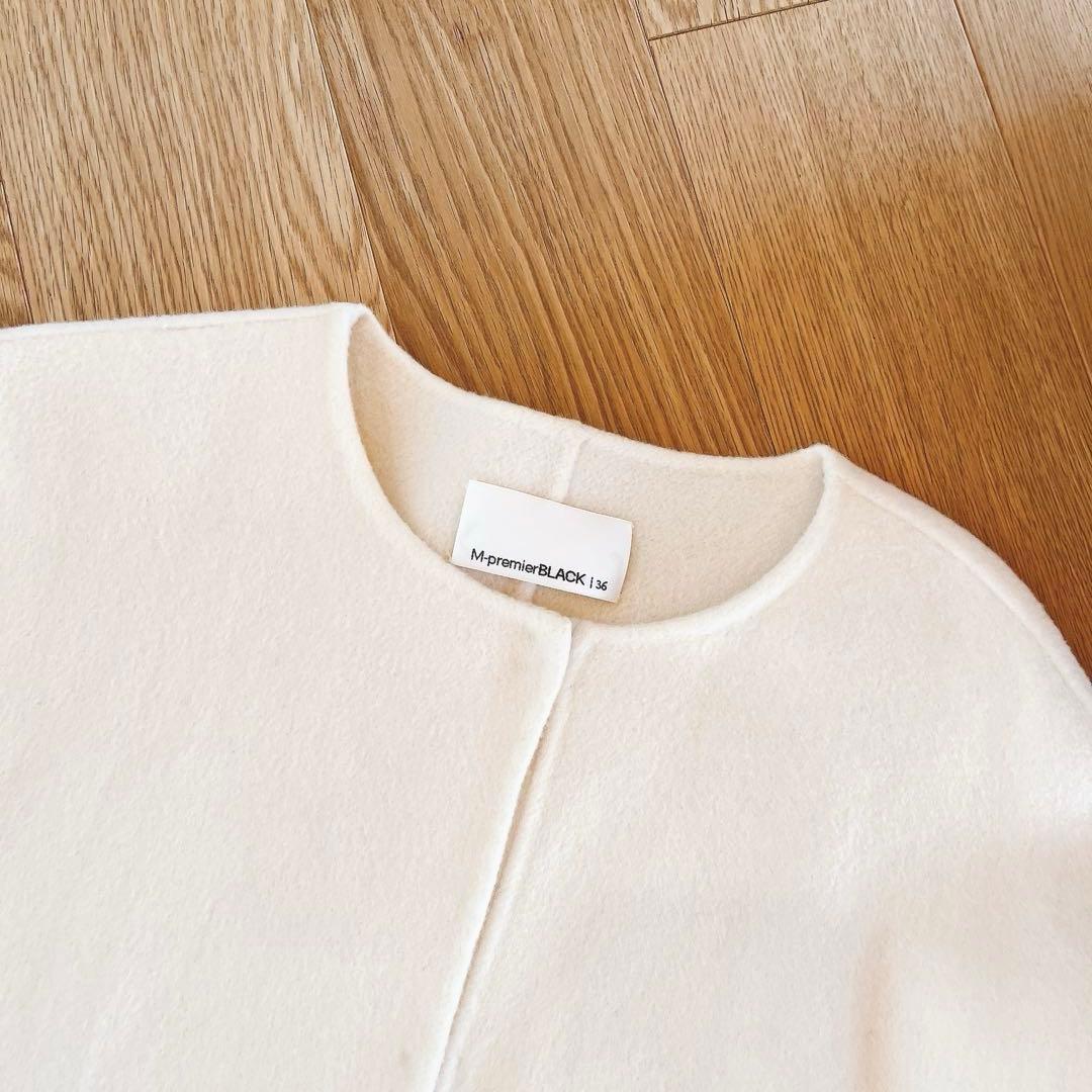 mid. エムプルミエ　ブラック ノーカラーフレアケープコート　アイボリー