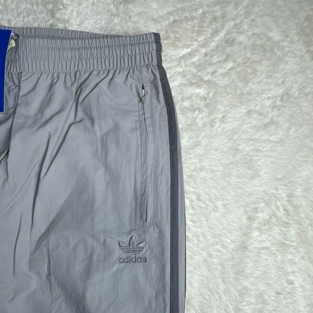 アディカラー ウーブン ファイヤーバードトラックパンツ ジャージ グレー