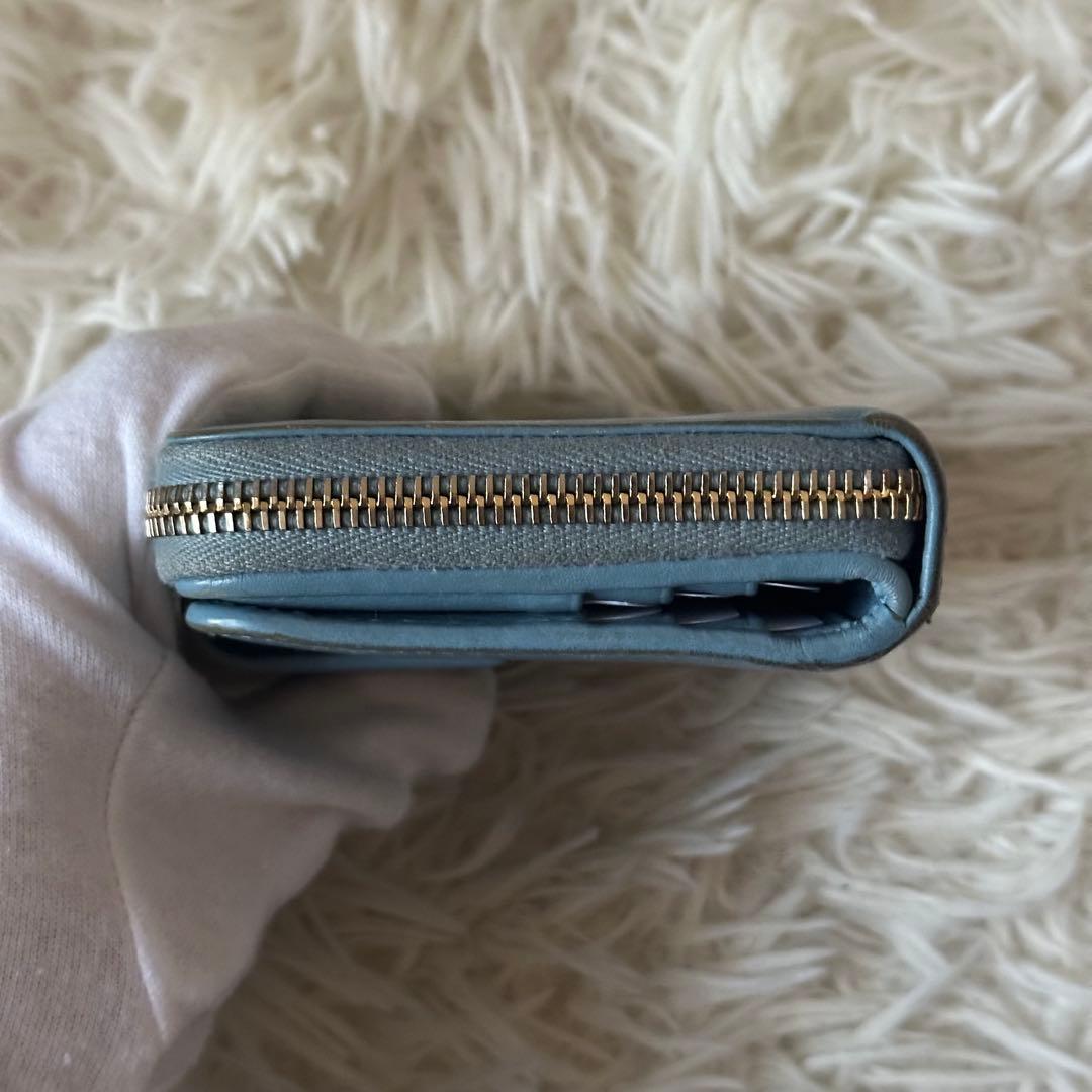 イヴサンローラン 二つ折り財布 型押し レザー ジップ ライトブルー コンパクト