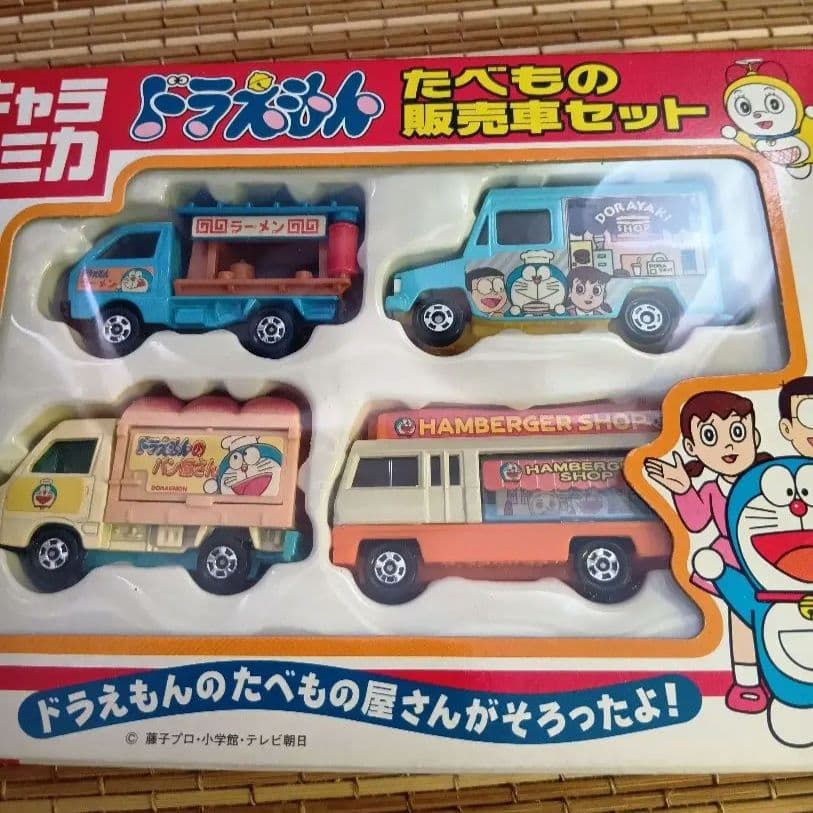 【新品未開封】キャラトミカ　ドラえもん　たべもの販売車セット&運搬車セット