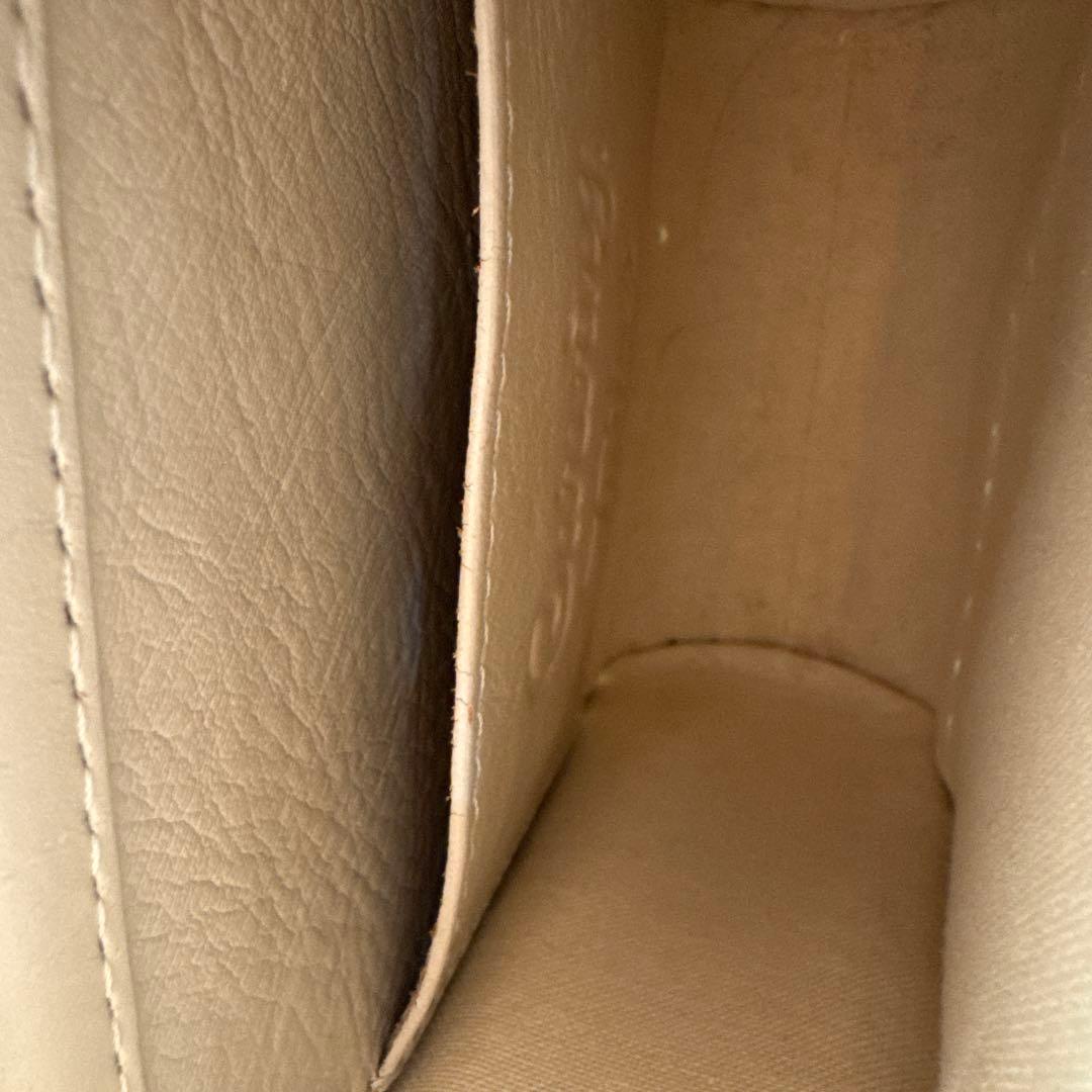 Carving Tribes エンボス花柄ショルダーバッグ