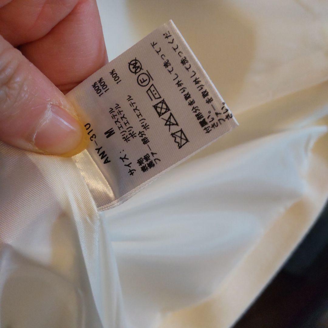 アンミールリボン付きノーカラーフレアコートホワイト