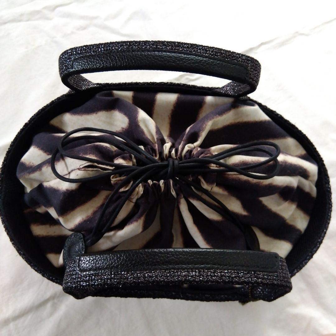 シンクビー　バッソサバーナバック　ブラック/アニマル柄（収納袋付き）