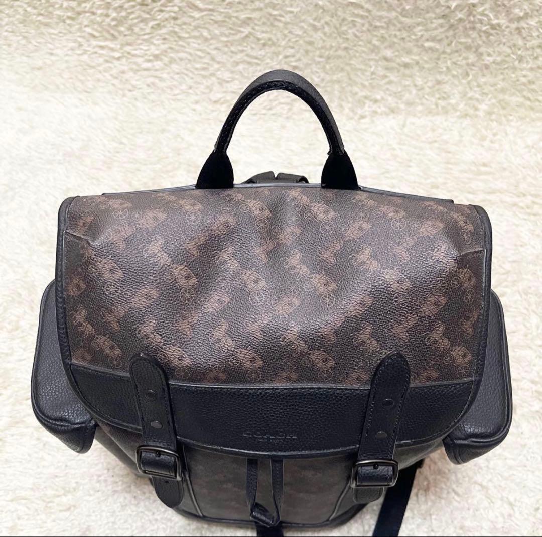 【美品/A4可】COACH 巾着　リュック　レザー　PVC　黒　馬車柄　ロゴ金具