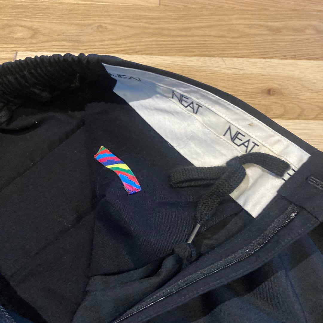 NEAT × isness コラボスラックス　Lサイズ