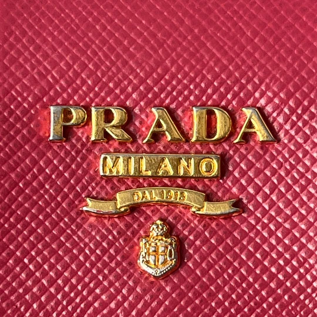 良品✨PRADA フィオッコ　サフィアーノ　メタルロゴ　リボン　ピンク　長財布