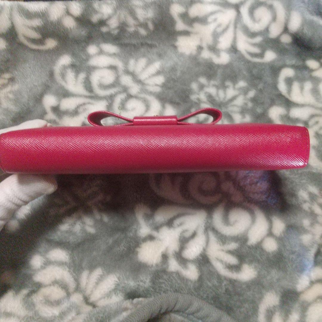 PRADA サフィアーノラウンドファスナーリボン付き長財布 レッド系