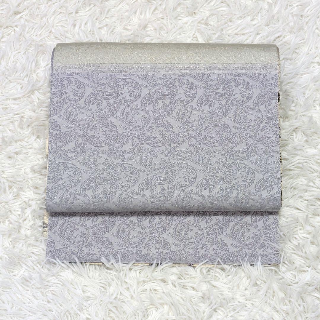 【全通柄】正絹袋帯　白地に蝶・花文様の紅型調　両面使用可　淡紫〜生成りのぼかし調