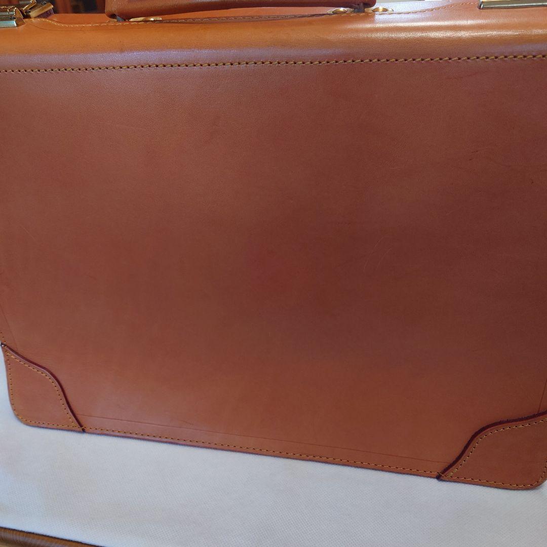 FIVEWOODSオレンジ レザービジネスバッグ（保管袋付き：PRADA）