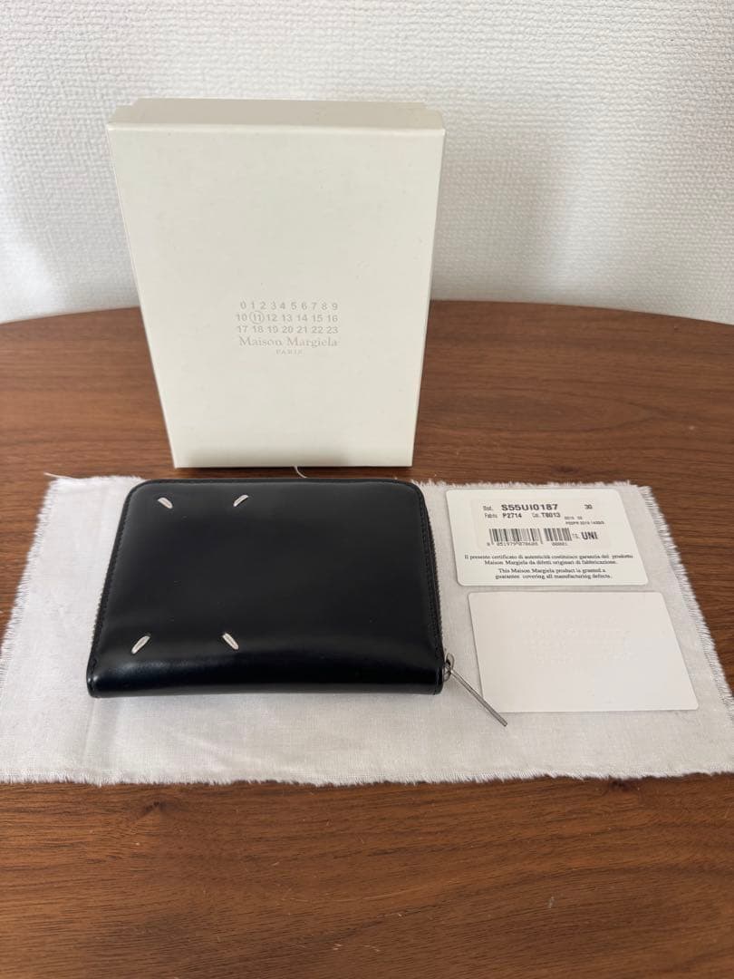 マルジェラ ラウンドジップ折り財布 なりた