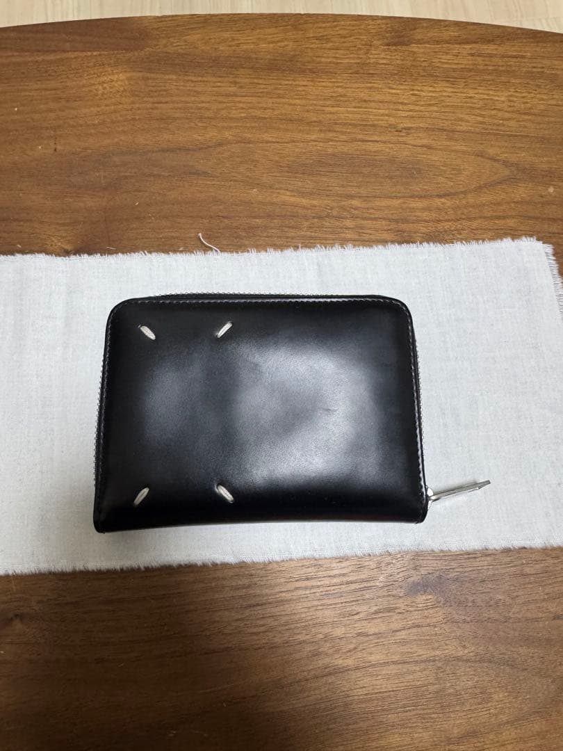 マルジェラ ラウンドジップ折り財布 なりた