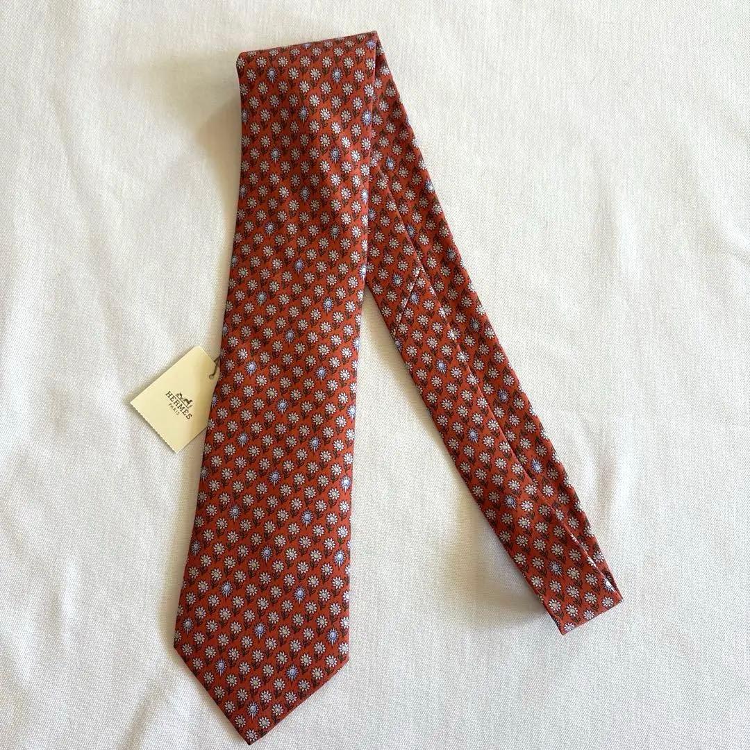 エルメス ネクタイ新品 花柄 オレンジ色 ひまわり柄 太陽柄 おひさま柄