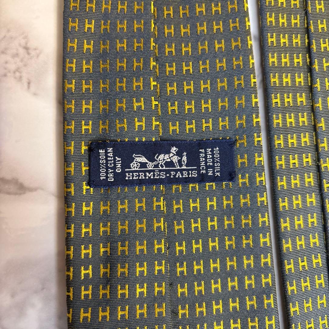 HERMES ネクタイ　イエロー　ネイビー　黄色　紺色　ファソネ　H柄　総柄　艶