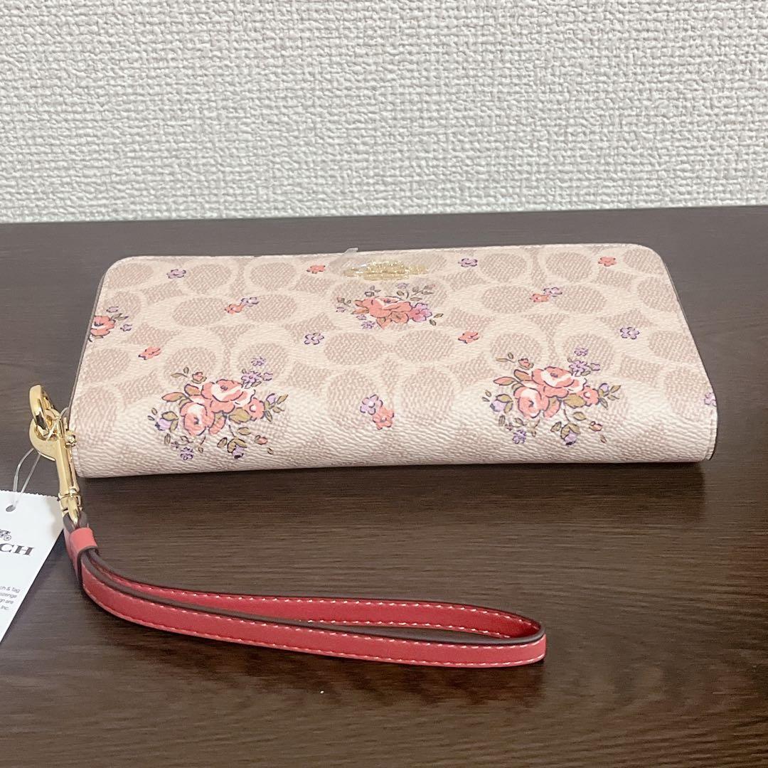 コーチ　 長財布　ベージュ　ストラップ付　花柄　シグネチャー　ラウンドファスナー