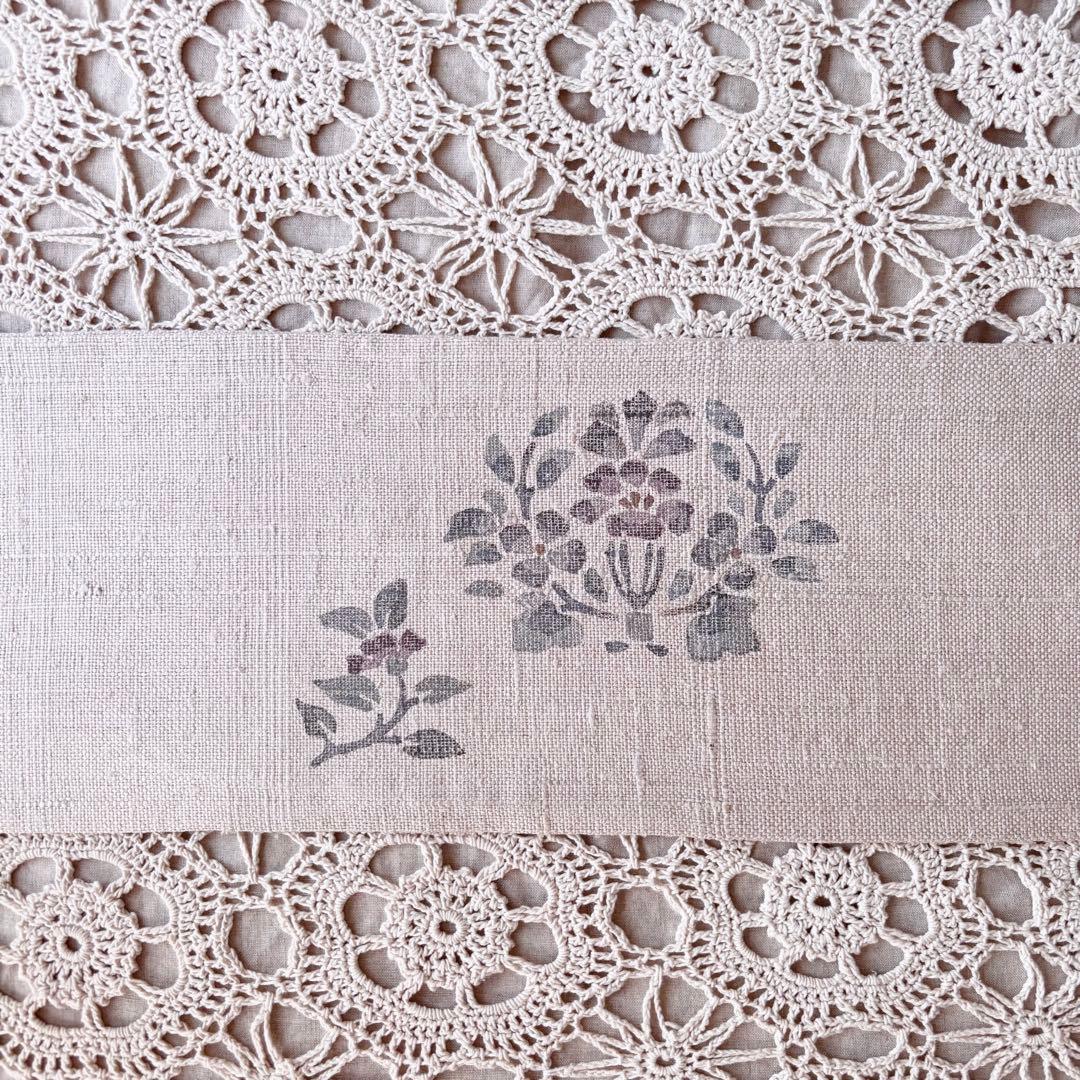 花と鳥の模様 くすんだピンクグレー ピンクベージュ 名古屋帯 紬帯