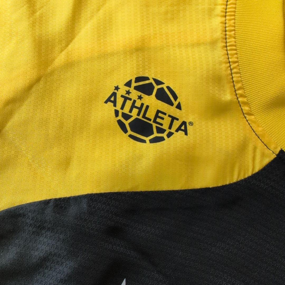 ATHLETA ピステ上下セット 150 黒/黄色