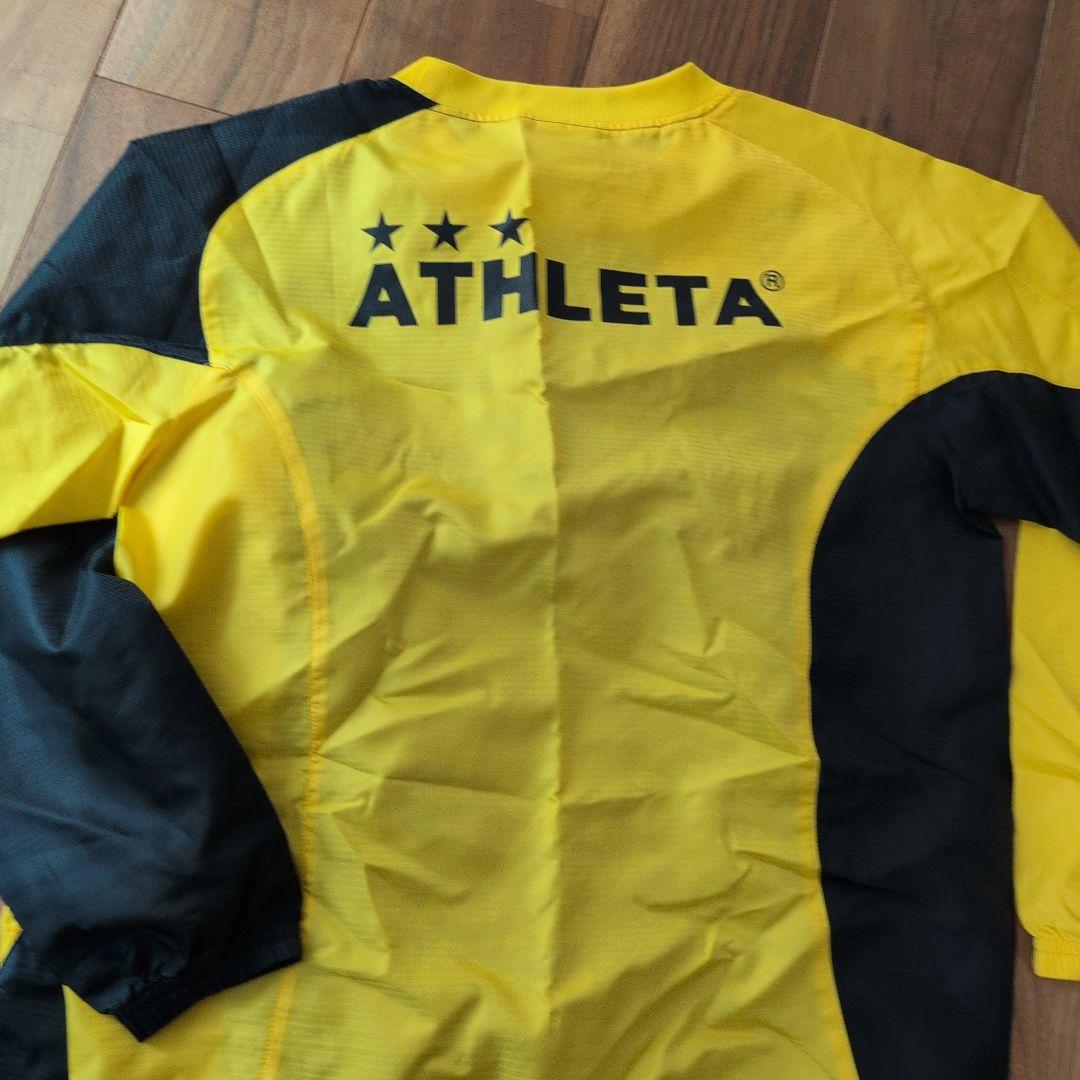 ATHLETA ピステ上下セット 150 黒/黄色
