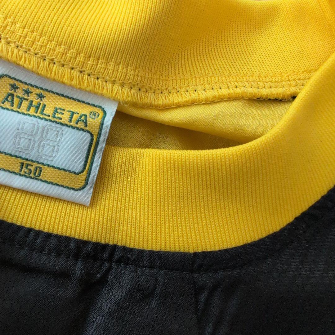 ATHLETA ピステ上下セット 150 黒/黄色